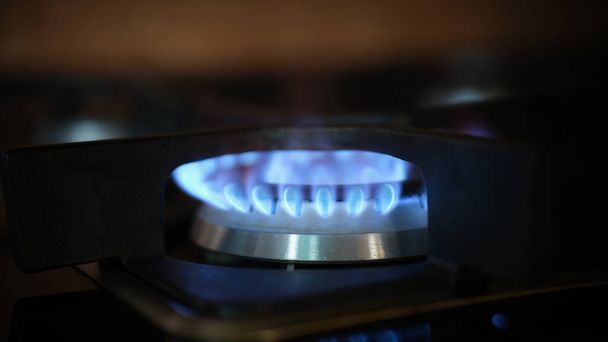 Cooking gas stove fire and electric stove closeup - Foto, imagen