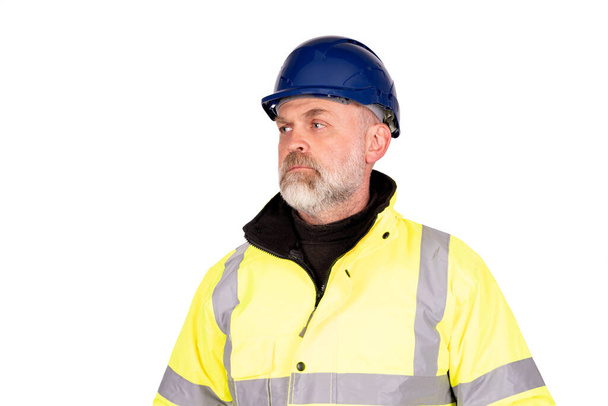 A construction worker in a blue hat and yellow hi-viz coat on white background with cpace for text - Fotoğraf, Görsel