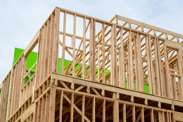 New residential construction home framing plywood wooden development - 写真・画像