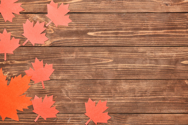 Paper maple leaves on wooden background. Happy Canada Day - Φωτογραφία, εικόνα