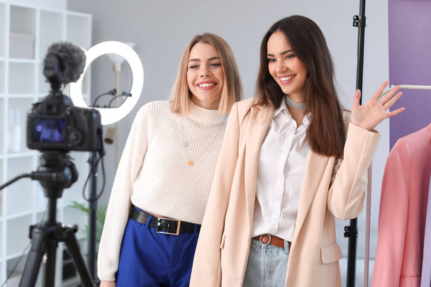 Young female fashion bloggers recording video in studio - Photo, Image
