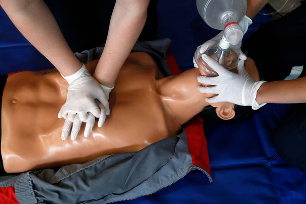 Life-saving first aid on a model.  Training session exercise.  Heart massage.  France.  - Foto, immagini