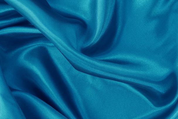Blue fabric cloth texture for background and design art work, beautiful crumpled pattern of silk or linen. - Foto, Bild