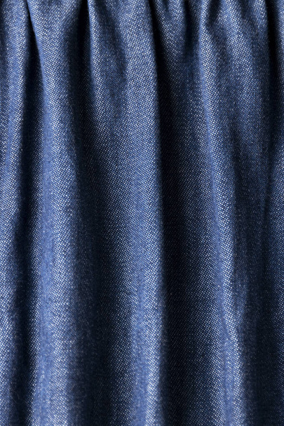 Jeans cloth, denim blue weathered material, trendy fashion textile - Fotó, kép