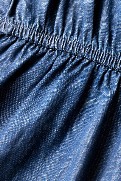 Jeans cloth, denim blue weathered material, trendy fashion textile - Photo, image