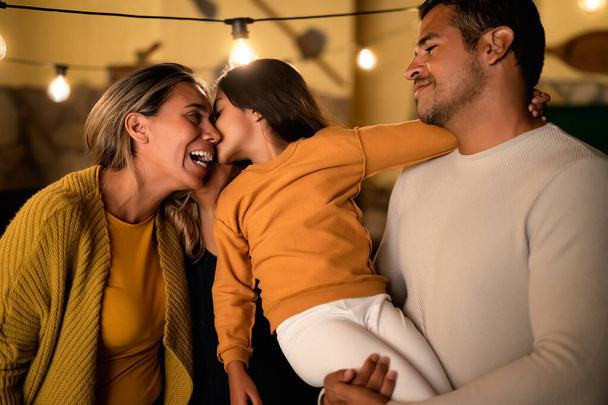 Happy Hispanic family enjoying time together at home - Fotoğraf, Görsel