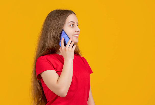 kid speak on smartphone on yellow background - Foto, Bild