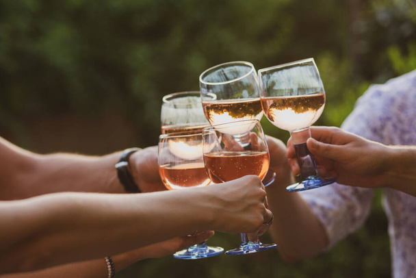Party at sunset. Glasses with alcohol. Alcohol. Champagne with friends. Glasses of champagne in summer. Summer. Friends are relaxing at a party. Fun with proseco. dinner - Fotó, kép