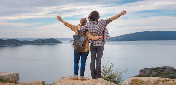 Couple traveler explore ruins castle of Simena with view of sea bay and Kekova Island with famous flooded city. Tourist attractions in Turkey. - Foto, imagen