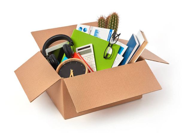 Cardboard box full with office supplies - 写真・画像