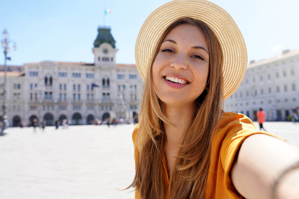 Cultural tourism in Italy. Self portrait of smiling traveler girl visiting Trieste, Italy. - Foto, immagini