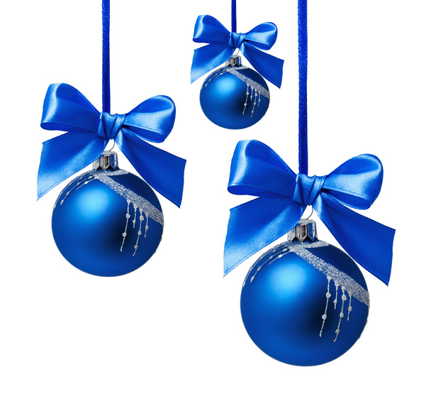 Blue christmas balls with ribbon isolated - Foto, Bild