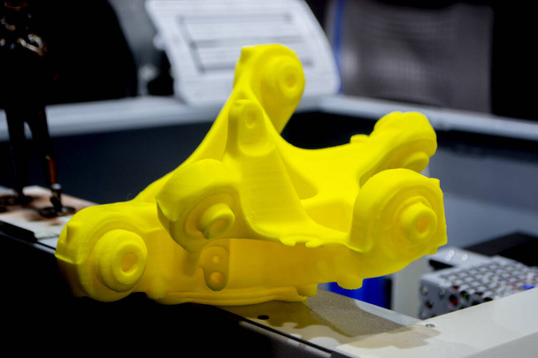 Yellow abstract 3D printed model. Objects printed on 3D printer from plastic - 写真・画像