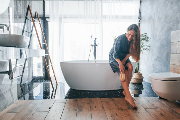 Beautiful young woman have free time at home in the bath. - Фото, изображение