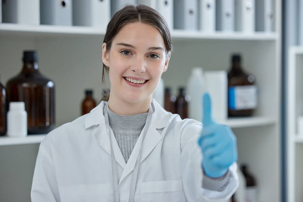 Proving all her theories correct. Portrait of a young scientist showing thumbs up in a lab. - Photo, Image