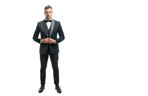 full length of grizzled man bridegroom in formal tuxedo isolated on white with copy space - Photo, image