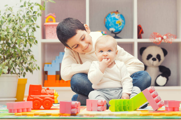kids playing with colourful building blocks at home or kindergarten - Φωτογραφία, εικόνα