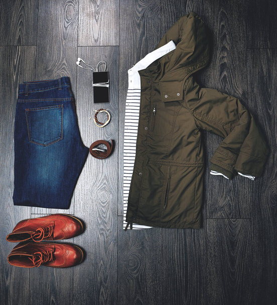 Ready for the weekend. High angle shot of a casual outfit on a wooden outfit. - Photo, Image