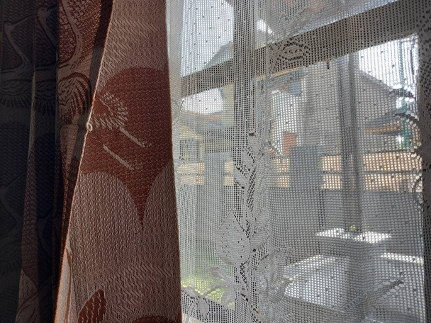 old Indonesian style curtains.  equipped with lace curtains. - Fotó, kép