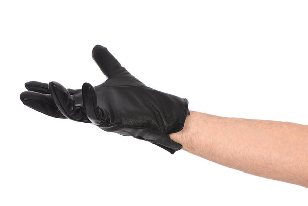 Man wearing black leather glove on white background, closeup. Side view. High resolution photo. Full depth of field. - 写真・画像