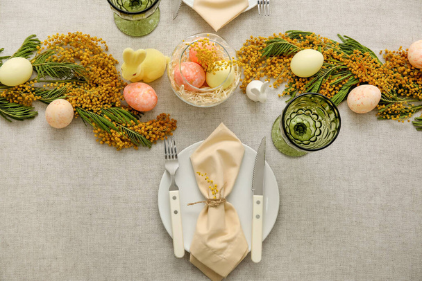 Festive table setting for Easter celebration on light background - Photo, Image