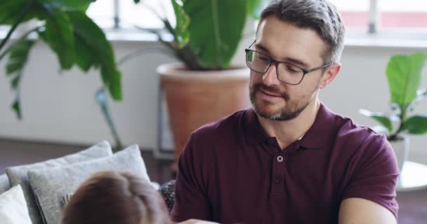 Single dads are superheroes. 4k video footage of a father braiding his daughters hair at home. - Záběry, video