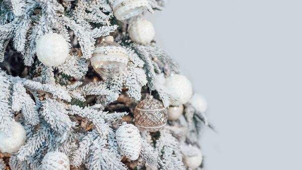 Closeup of Decorated Christmas tree on blurred, sparkling and fairy light background. - Valokuva, kuva