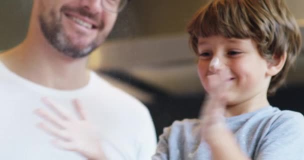 And now for some flour power. 4k video footage of an adorable little boy baking with his father at home. - Filmmaterial, Video