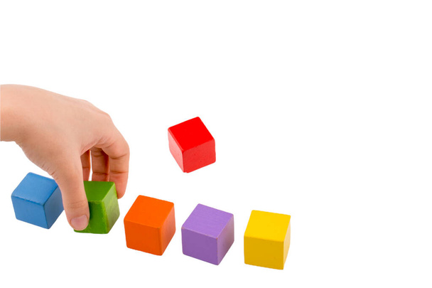 Hands playing and building with colorful wooden toy blocks. Early learning and development - Photo, Image