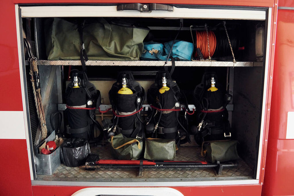 Oxygen balloons. Close up view of firefighter's equipment that is inside of the truck. - Zdjęcie, obraz