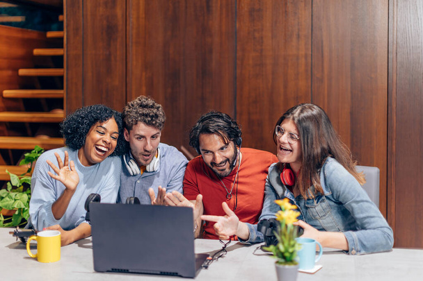 group of young influencers streaming using a laptop - Fotó, kép