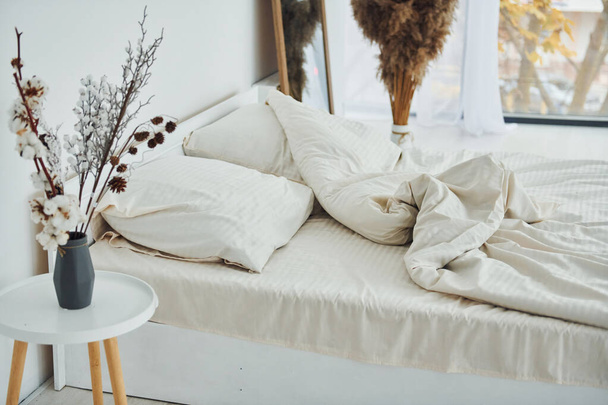 White bed. Interior and design of beautiful modern bedroom at daytime. - Φωτογραφία, εικόνα