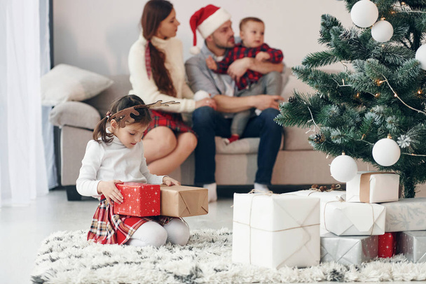Beautiful family celebrates New year and christmas indoors at home. - Valokuva, kuva