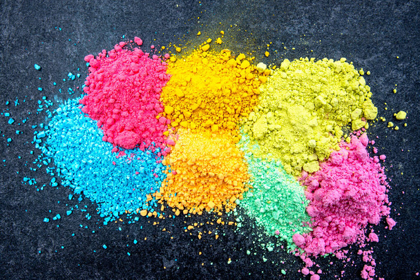 Various dry color powder for painting. Vibrant colors on black background - Photo, image