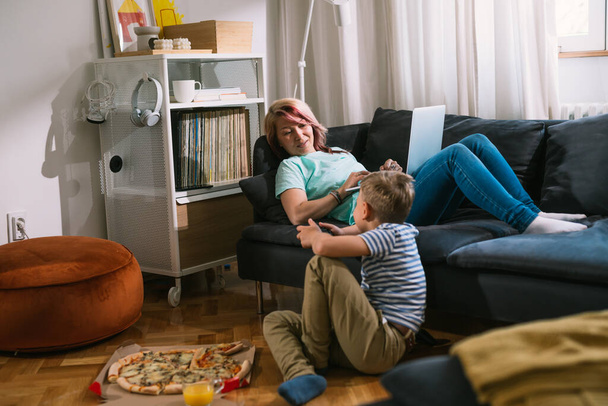 young boy enjoying time with his mother at home - Fotografie, Obrázek