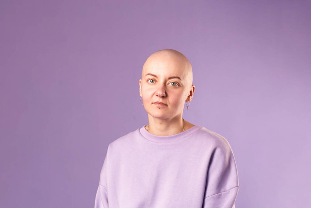 Young woman suffering from cancer laugh smile feel positive about future recovery. Millennial female with shaved head - Photo, Image