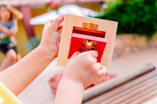 Wooden boxes with locks, educational montessori material to manipulate objects by children with dexterity. - Foto, Imagem