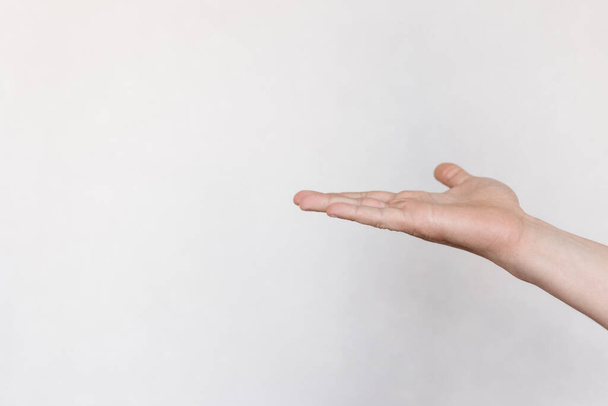 two hands with indicate the direction on a light background - Photo, image