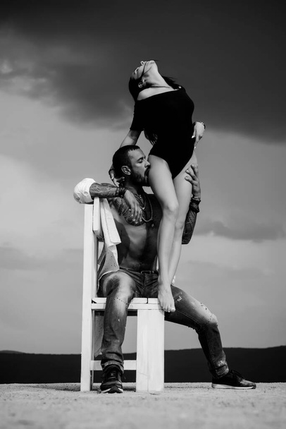 Trust him. Man in tattooes. Couple in love on dark sky background. Young sexy couple. - Foto, immagini
