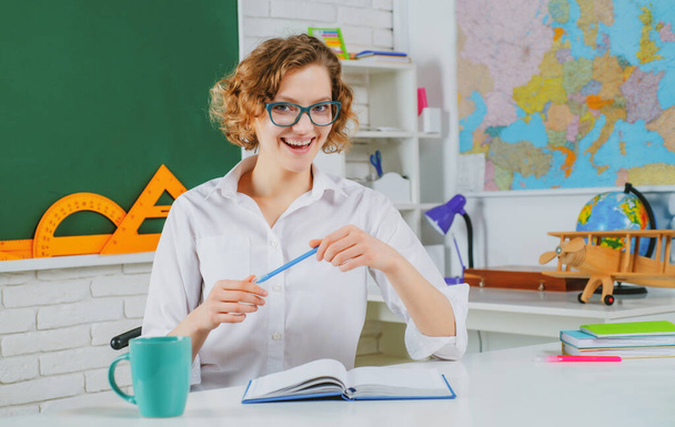 Happy school woman teacher in classroom. Education and Teachering concept. - Foto, Imagen