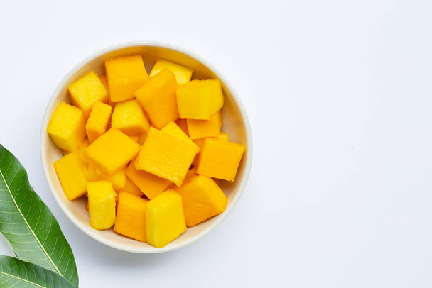 Tropical fruit, Mango in white bowl on white background. Top view - Photo, Image