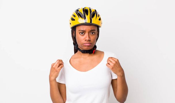 pretty afro woman with braids with a bike helmet - Fotografie, Obrázek