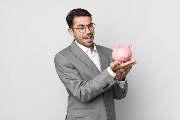 young adult handsome hispanic man savings and business concept - Foto, afbeelding