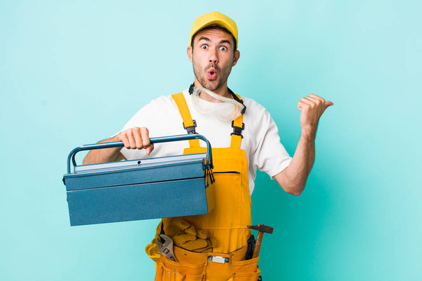 young adult man. plumber and toolbox concept - Photo, Image