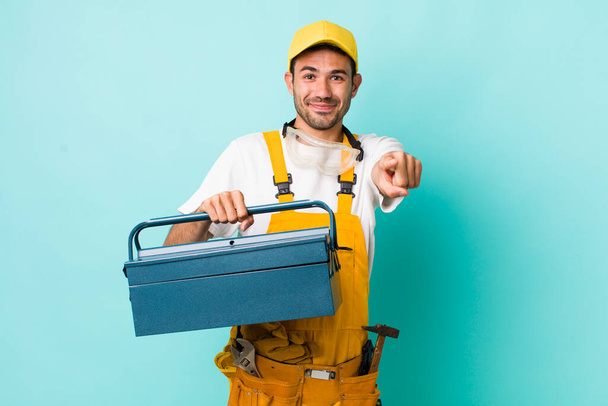 young adult man. plumber and toolbox concept - Foto, afbeelding