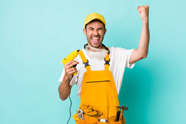 young adult man. handyman or repairman concept - Foto, imagen