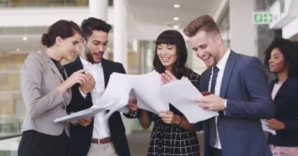 We prepared, we worked hard, now to celebrate. 4k video footage of a group of businesspeople celebrating by throwing paperwork in the air in an office. - Footage, Video