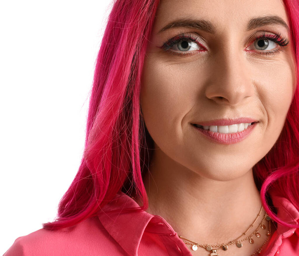 Beautiful woman with bright pink hair on white background, closeup - Photo, image