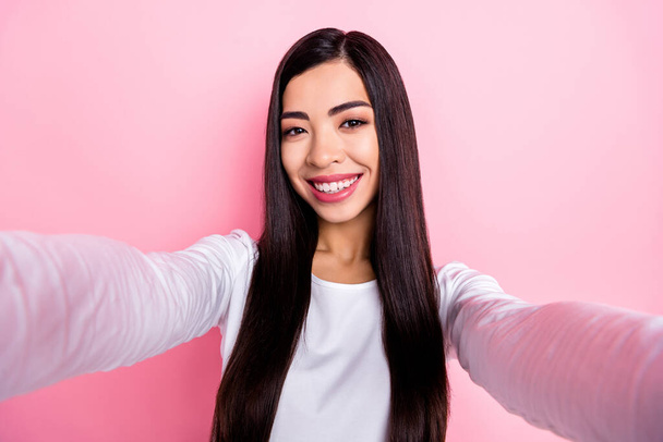 Photo of nice millennial brunette lady do selfie wear white shirt isolated on pink color background - Фото, зображення