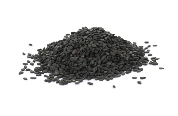 Heap of black sesame seeds on white background - Foto, afbeelding